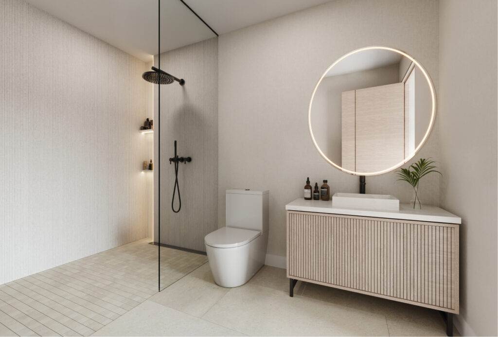 A modern bathroom with a minimalist design, featuring a walk-in shower with a glass partition and a rainfall showerhead.