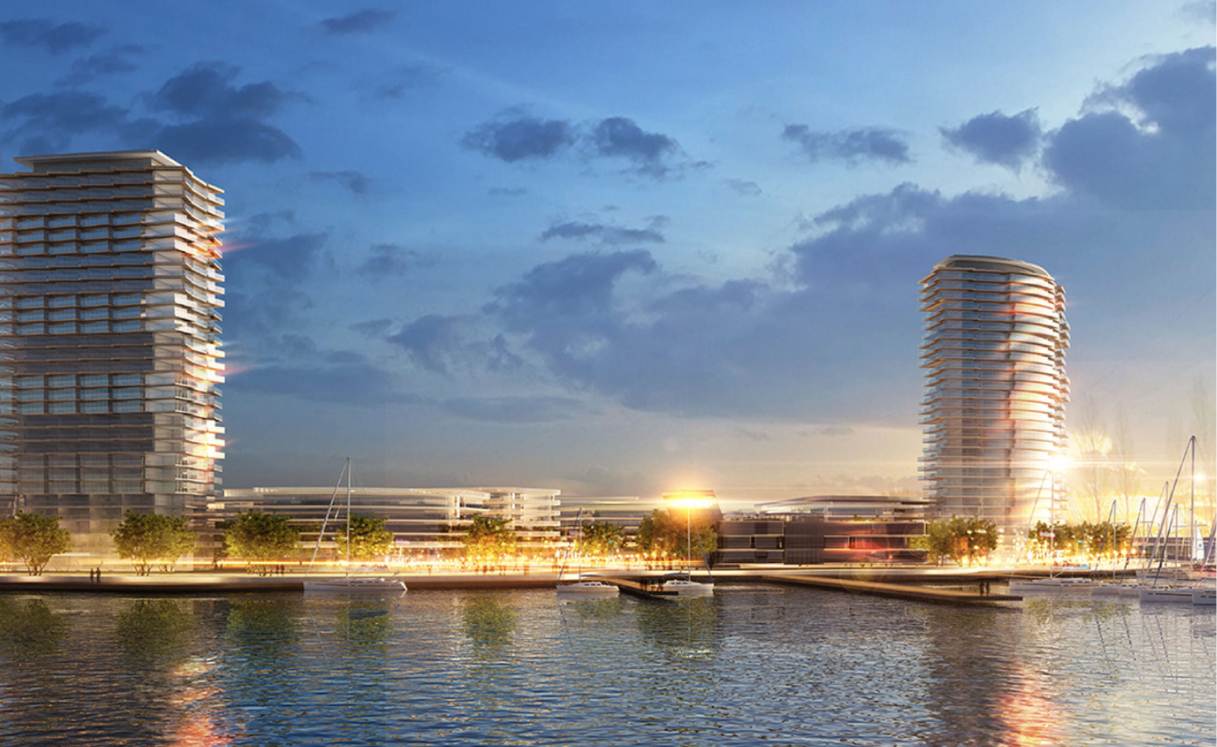 A waterfront cityscape at dusk, featuring two modern high-rise buildings with distinct architectural styles.