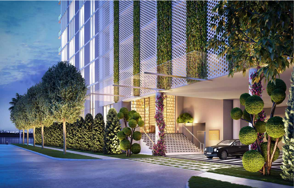 An elegant entrance area of a modern building, featuring vertical greenery walls, a sleek vehicle parked near the entrance, and well-manicured trees and plants.